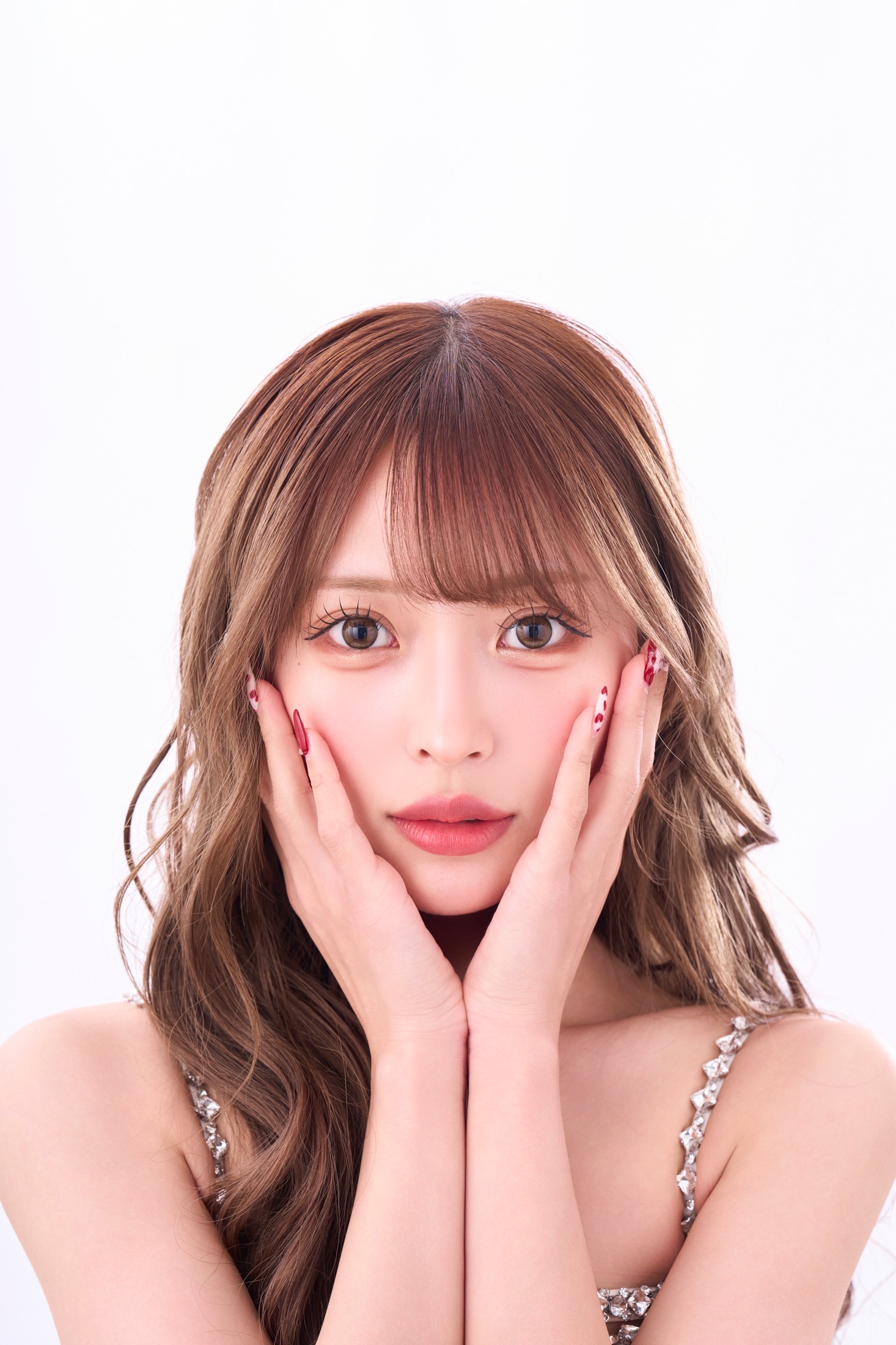 なー に ー